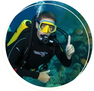a person in scuba gear with a thumbs up